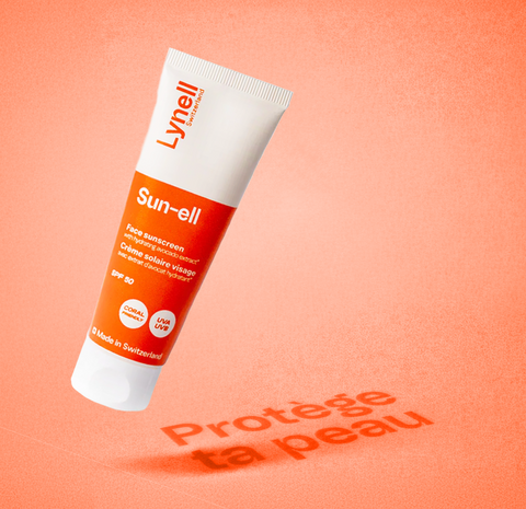 Tube de crème solaire visage Sun-ell SPF 50 Lynell Switzerland sur fond orange